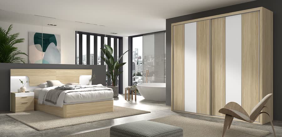 Dormitorio con cama y armario de puertas correderas en madera clara